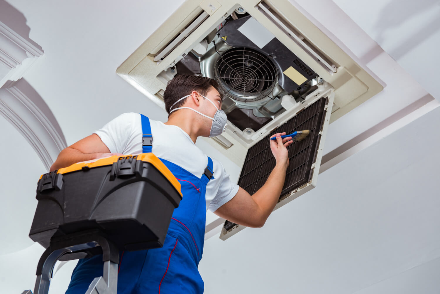 worker-repairing-ceiling-air-conditioning-unit (2)